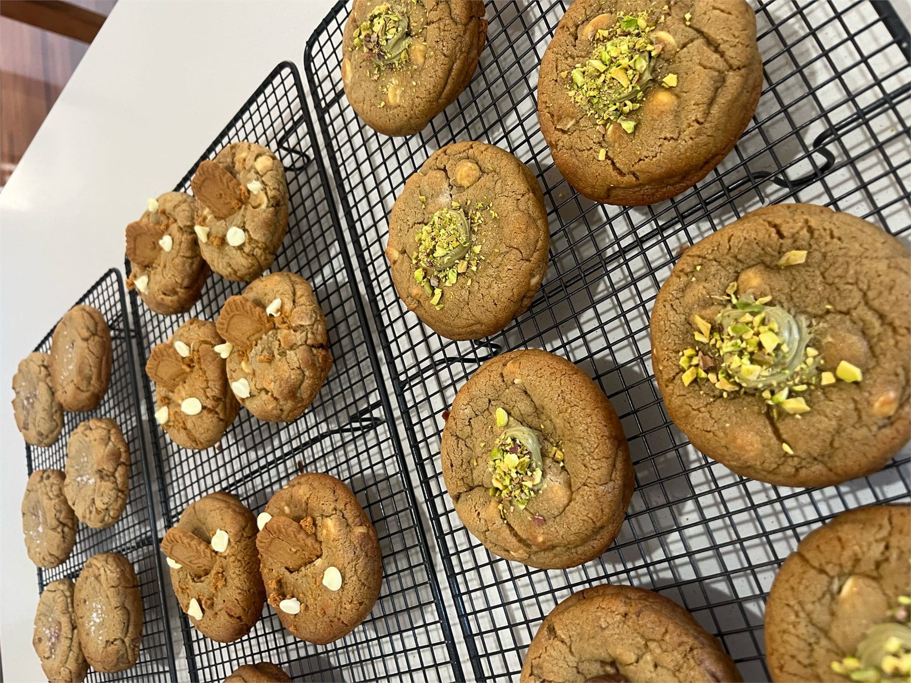 Freshly baked cookies cooling on a wire rack